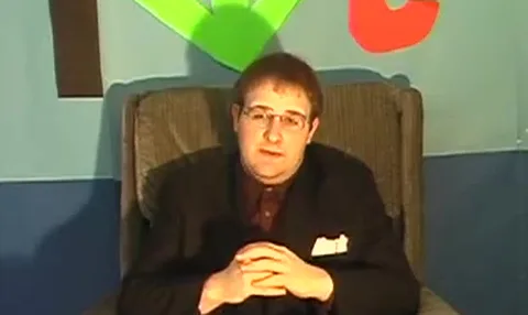 Jon signing off from the armchair on the TWJ set